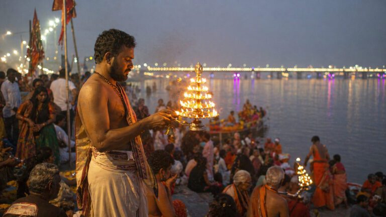 Priest performing evening aarti at Godavari Pushkaralu